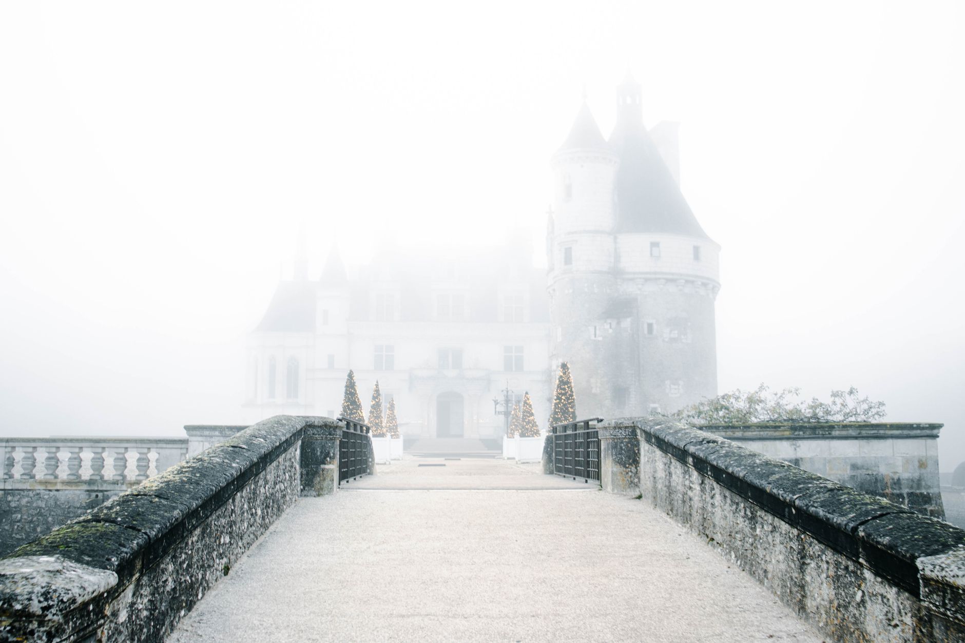 Chenonceau Castle viewed from the bridge in the fog